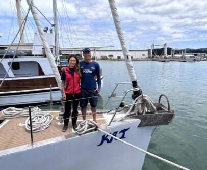 Voice of the Oceans crew standing on Kat, their sailing catamaran