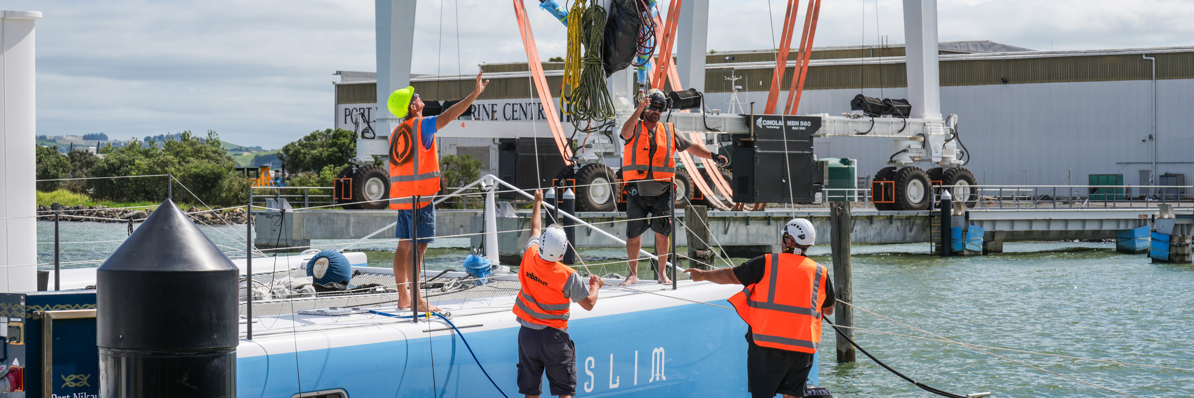 Contractors working on SLIM Superyacht at Port Nikau