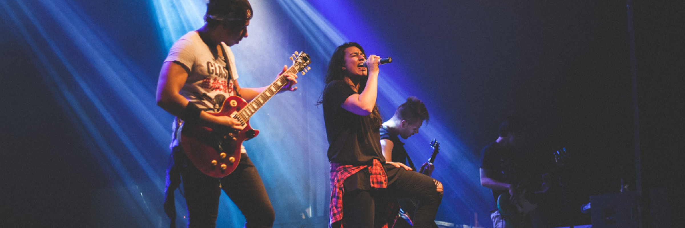 Musicians play music live on stage in Whangarei